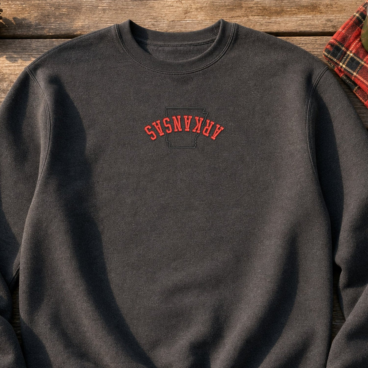 Arkansas State Upside Down embroidery design stitched on a heavyweight fleece crewneck sweatshirt