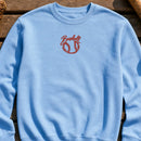 Baseball Abstract embroidery design stitched on a sky blue unisex lightweight cotton crewneck sweatshirt