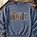 Denver Landmarks embroidery design stitched on a heather slate-blue midweight crewneck sweatshirt