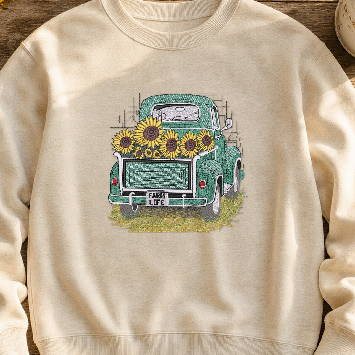 Farm Life Truck embroidery design stitched on an oatmeal midweight fleece crewneck sweatshirt