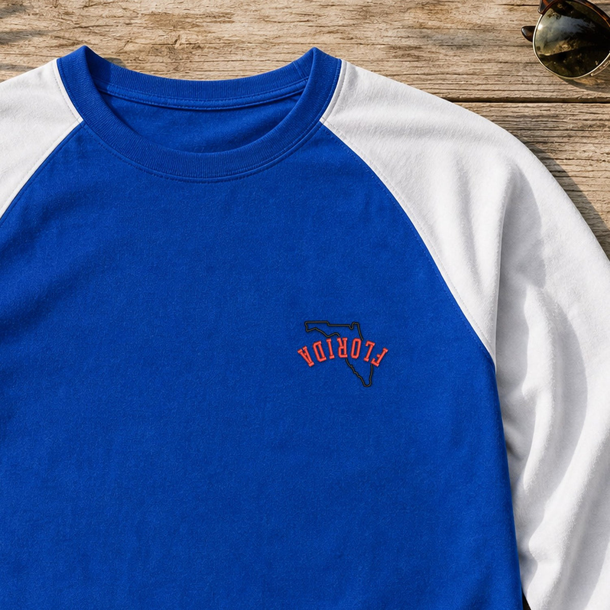 Florida State Upside Down embroidery design stitched on a royal blue baseball raglan tee