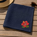 Flower Corner Hibiscus embroidery design stitched on a navy linen tea towel