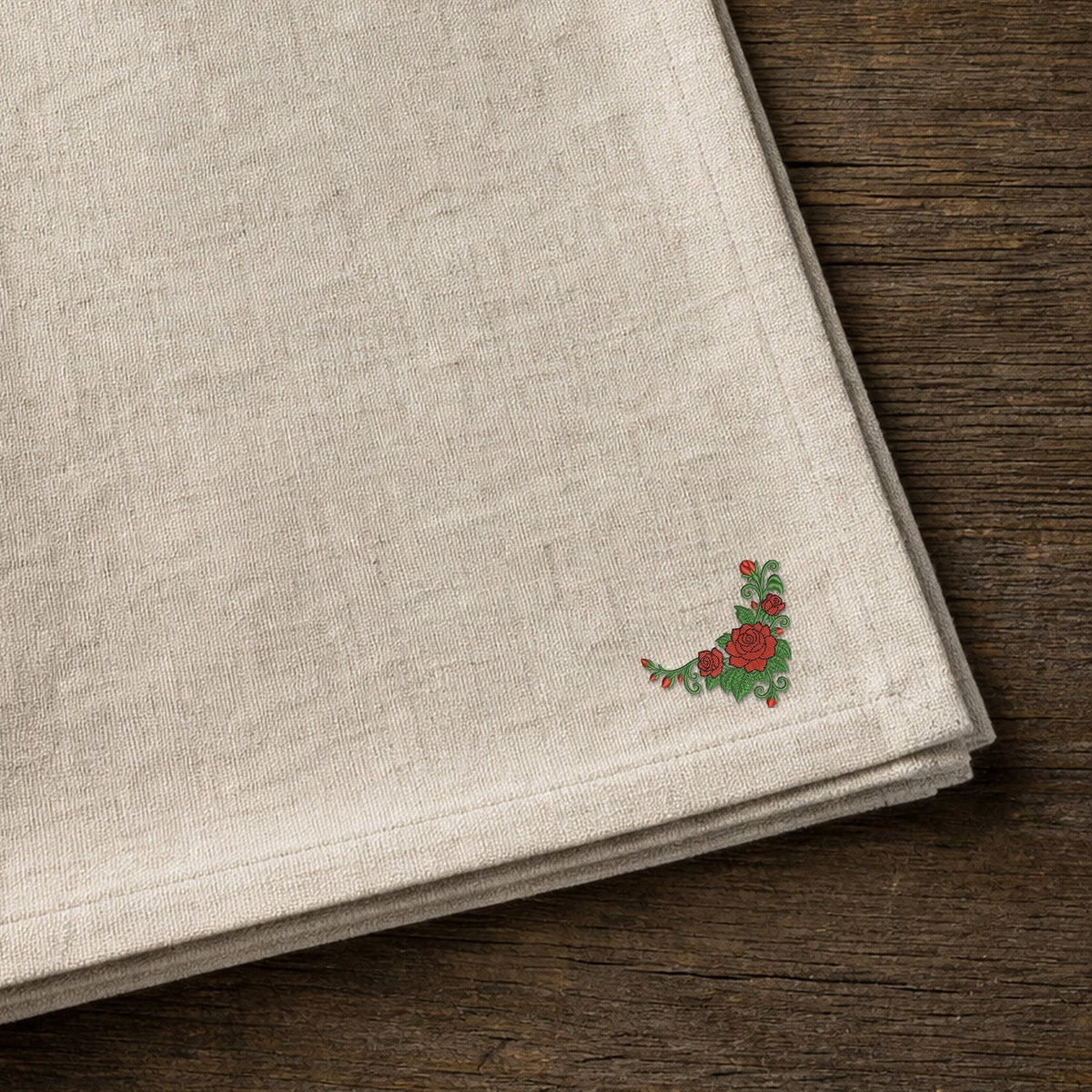 Flower Corner Rose embroidery design stitched on a natural linen-cotton tea towel