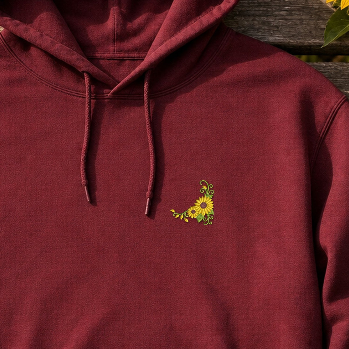 Flower Corner Sunflower embroidery design stitched on a deep maroon lightweight pullover hoodie