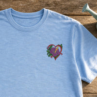 Flower Heart Purple Pansy embroidery design stitched on a soft sky-blue slub cotton crewneck