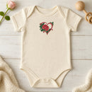 Flower Heart Rose embroidery design stitched on a natural cream short-sleeve baby onesie