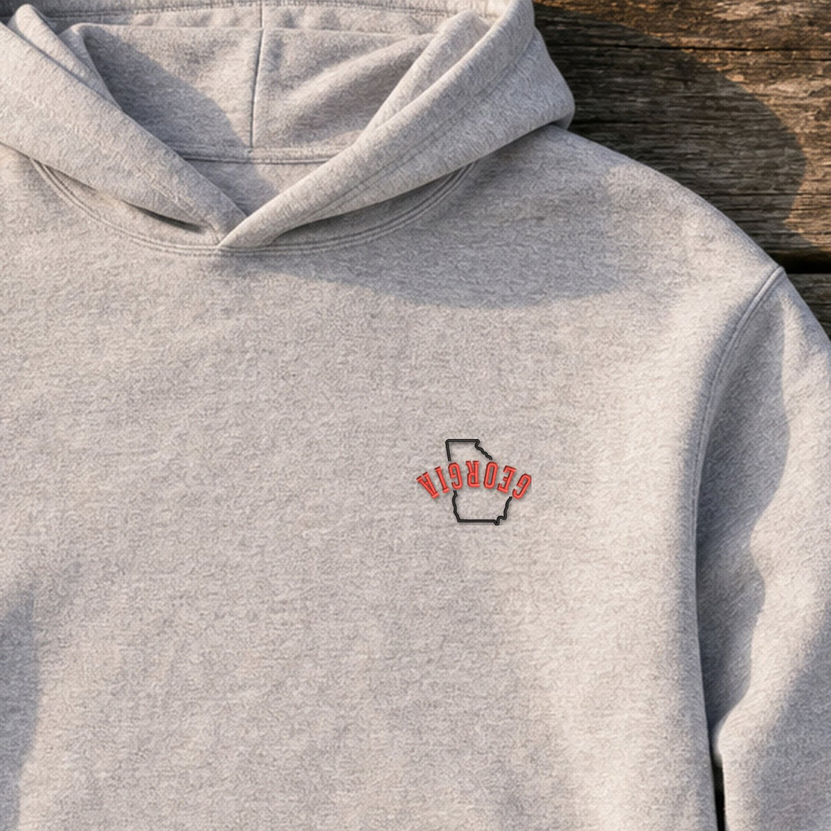 Georgia State Upside Down embroidery design stitched on a light heather grey pullover hoodie