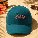 Hawaii State Upside Down embroidery design stitched on a teal structured cotton-twill mid-profile cap