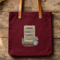 Home Sweet Home Sign Bucket embroidery design stitched on a deep burgundy 15x15 cotton canvas tote bag