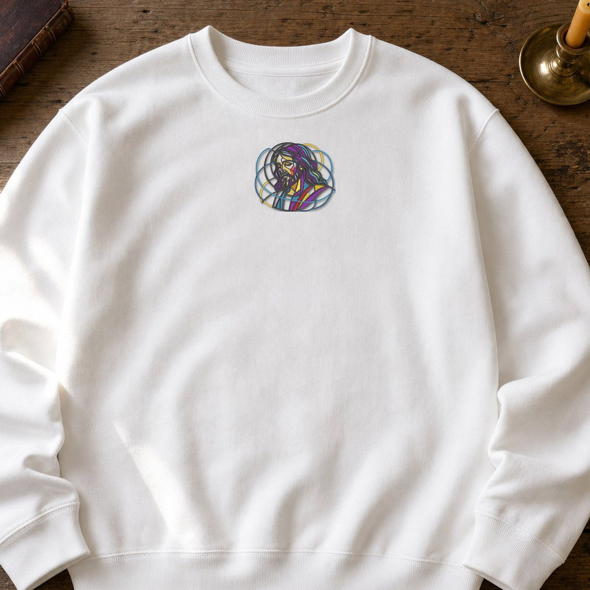 Jesus Abstract embroidery design stitched on a white heavyweight crewneck sweatshirt