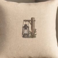 Lantern Post embroidery design stitched on a natural oatmeal linen throw pillow