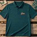 Lions Mascot Tail embroidery design stitched on a deep teal performance polo