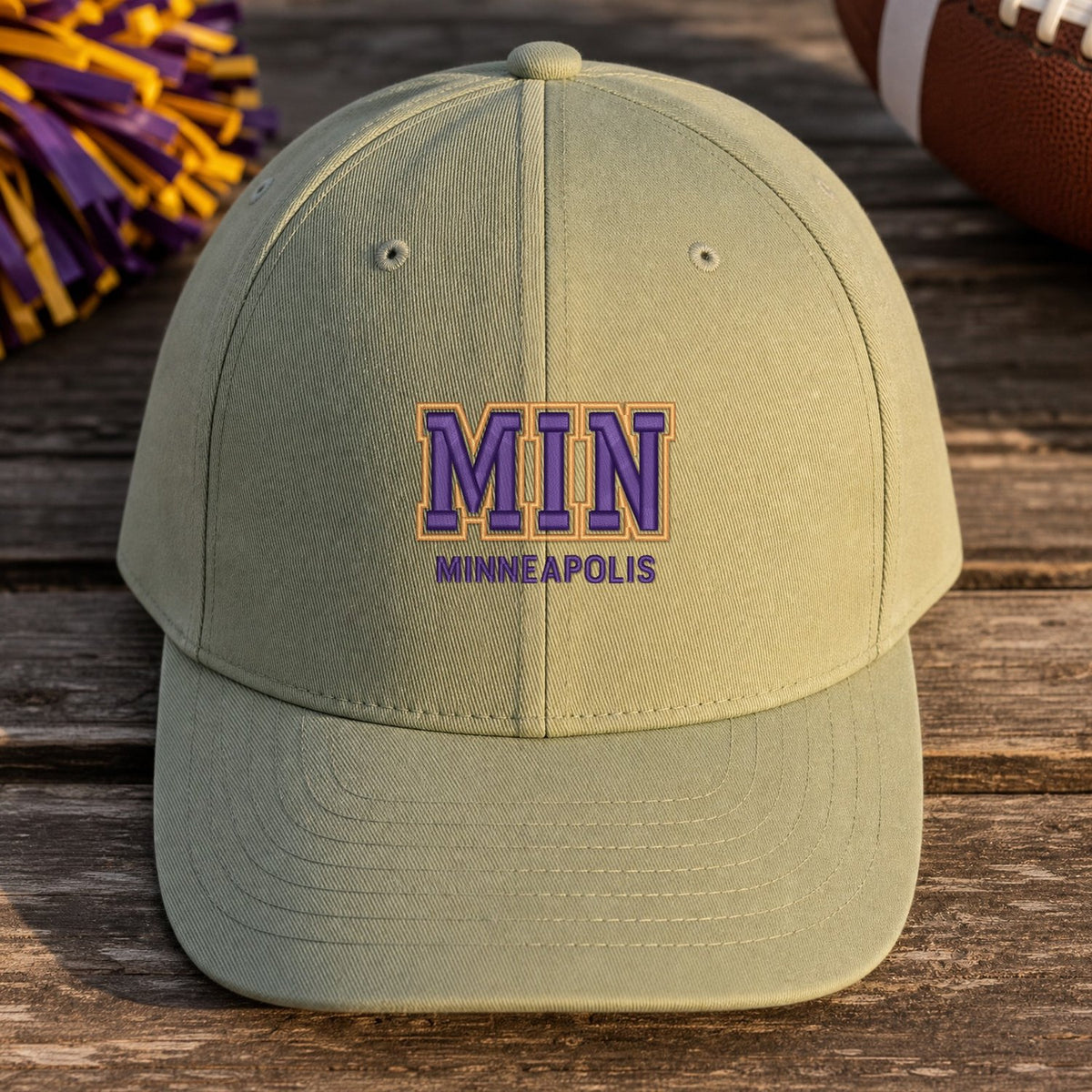 MIN Puff Cap embroidery design stitched on a light sage structured six-panel baseball cap