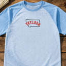 Montana State Upside Down embroidery design stitched on a light sky blue unisex short-sleeve baseball-style raglan tee