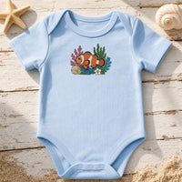 Ocean Clown Fish Floral embroidery design stitched on a soft sky-blue organic cotton baby onesie