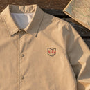 Ohio State Upside Down embroidery design stitched on a sand lightweight coach jacket
