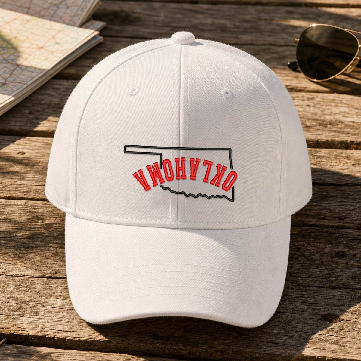 Oklahoma State Upside Down embroidery design stitched on a white structured six-panel baseball cap