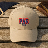 PAR Puff Cap embroidery design stitched on a sand structured six-panel baseball cap