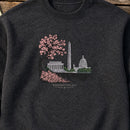 Peek at Washington embroidery design stitched on a deep heather charcoal fleece crewneck sweatshirt