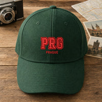 PRG Puff Cap embroidery design stitched on a forest green structured six-panel baseball cap