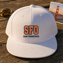 SFO Puff Cap embroidery design stitched on a crisp white structured 6-panel snapback cap