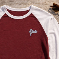 Sharks Mascot Tail embroidery design stitched on a maroon baseball raglan tee