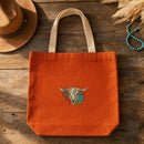 Skull Bull Flowers embroidery design stitched on a 15-inch heavy cotton canvas tote bag in burnt orange