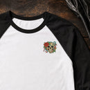 Skull Rose Flowers embroidery design stitched on a white unisex baseball raglan tee
