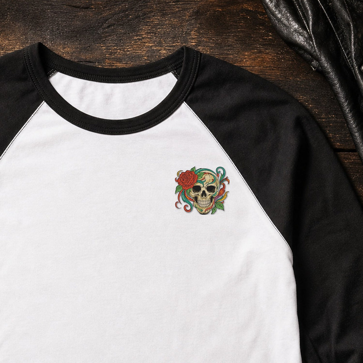 Skull Rose Flowers embroidery design stitched on a white unisex baseball raglan tee