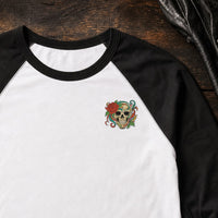 Skull Rose Flowers embroidery design stitched on a white unisex baseball raglan tee