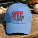 STL Puff Cap embroidery design stitched on a light sky blue structured mid-profile cap
