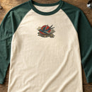Swallow Free Spirit Tattoo embroidery design stitched on a vintage cream baseball raglan tee