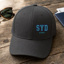 SYD Puff Cap embroidery design stitched on a charcoal structured six-panel baseball cap