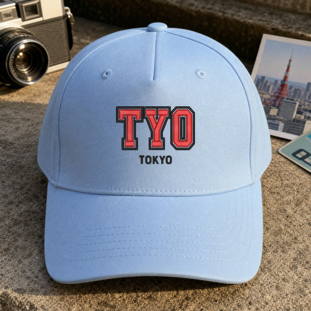 TYO Puff Cap embroidery design stitched on a light blue structured six-panel baseball cap
