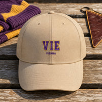 VIE Puff Cap embroidery design stitched on a sand structured six-panel baseball cap