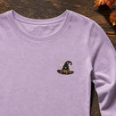 Witch Hat Stars Moon embroidery design stitched on a soft lavender long-sleeve crewneck tee