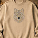 Wolf Head Run embroidery design stitched on a sand heavyweight crewneck sweatshirt